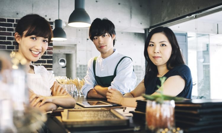 Bartenders working in cafe